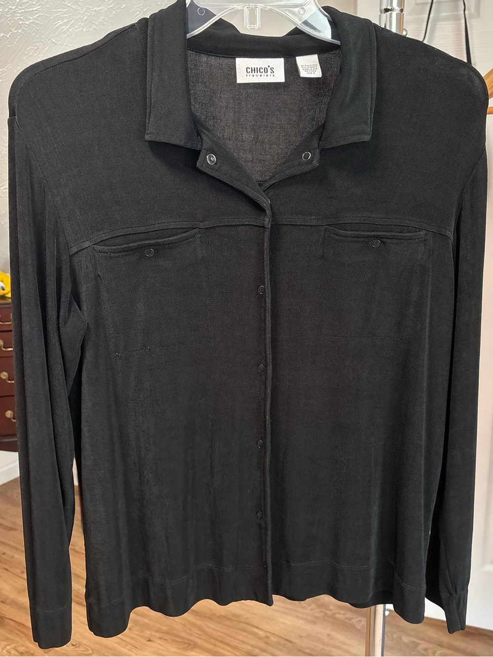 Minimalist black, slinky snap button down top. Chico's Travelers size 2